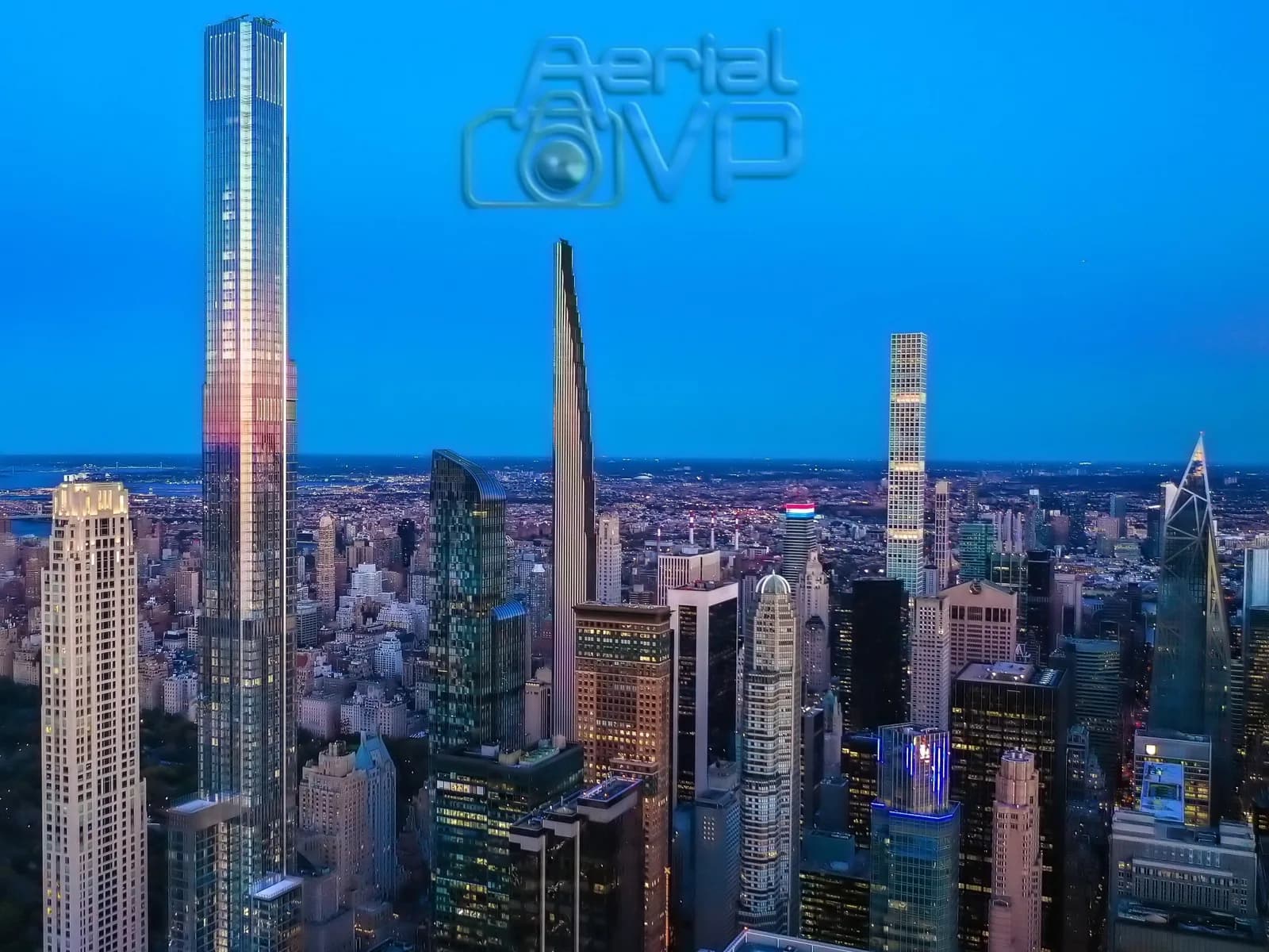 Aerial VP logo watermark over a city skyline with tall skyscrapers at dusk