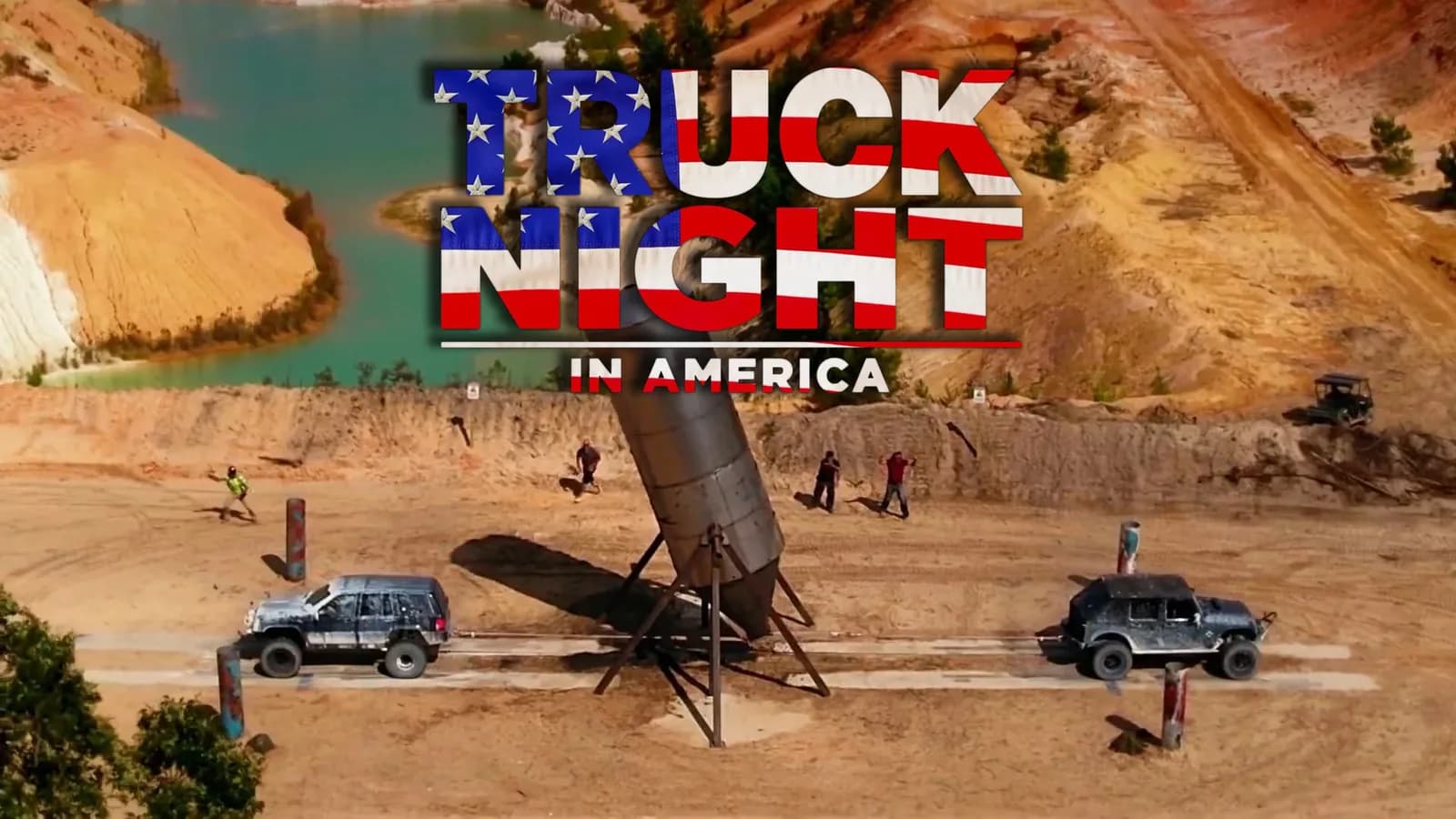 Truck night in America logo over a desert site with two jeeps and a tilted rocket-like structure