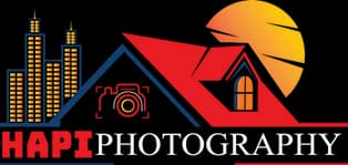 Logo featuring a skyline of yellow buildings, a red-roofed house, blue shapes, and a yellow sun