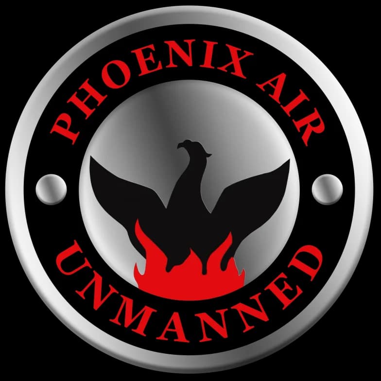 Phoenix Air Unmanned logo with a black phoenix over red flames inside a silver circular badge