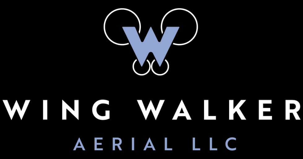 Logo for Wing Walker Aerial LLC featuring a stylized W with blue lines and white and blue text