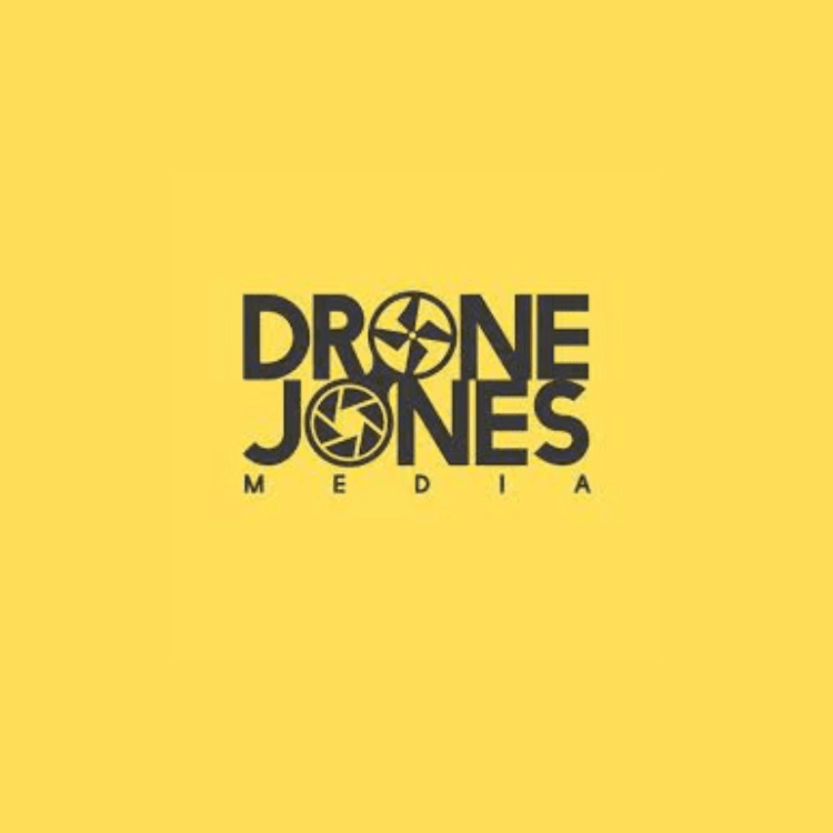 Drone Jones Media logo with black text and camera shutter motifs on a yellow background