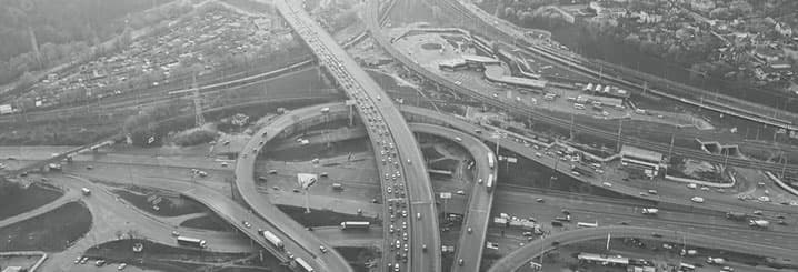 Aerial view of a complex highway interchange with multiple overpasses and traffic