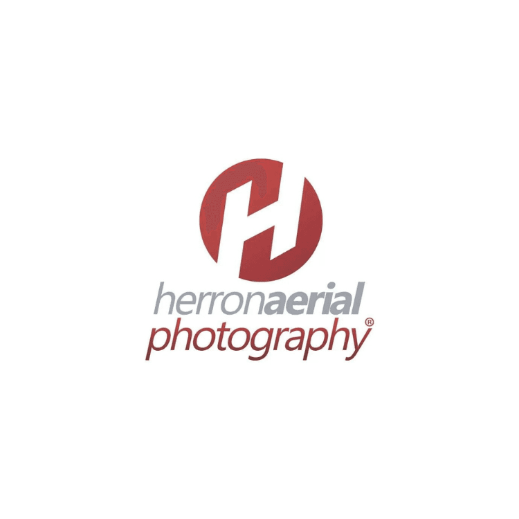 Logo featuring a red circle with a white stylized H and the text herron aerial photography in gray and red