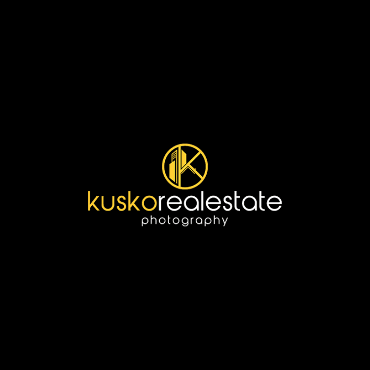 Logo for kusko realestate photography featuring a yellow circular emblem and white text